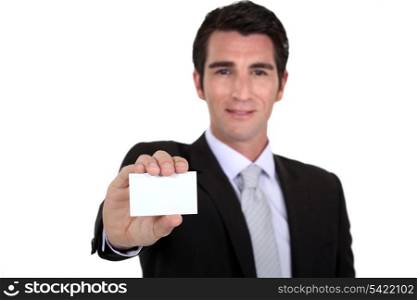 Confident businessman flaunting business card