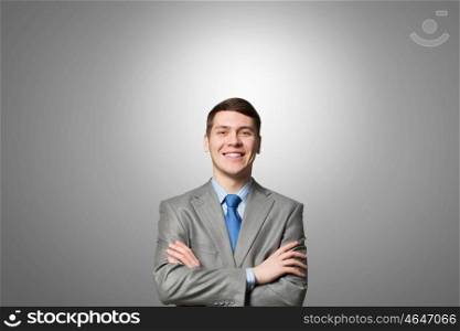 Confident businessman. Happy businessman with arms crossed on the chest