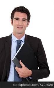 Confident businessman holding folder underarm