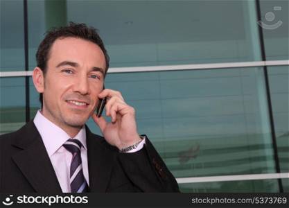 Confident businessman on phone