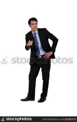 Confident businessman pointing at the camera