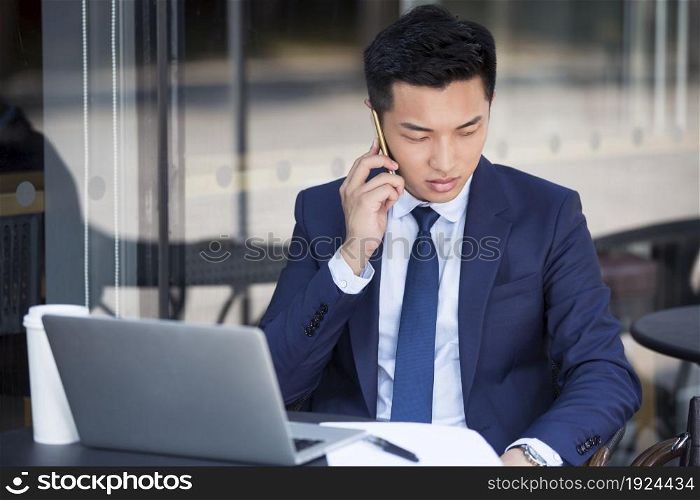 Confident businessman talking on the phone