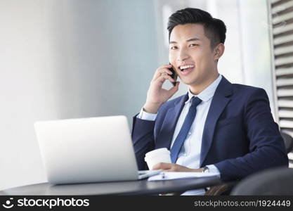 Confident businessman talking on the phone