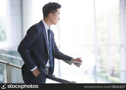 Confident businessman thinking