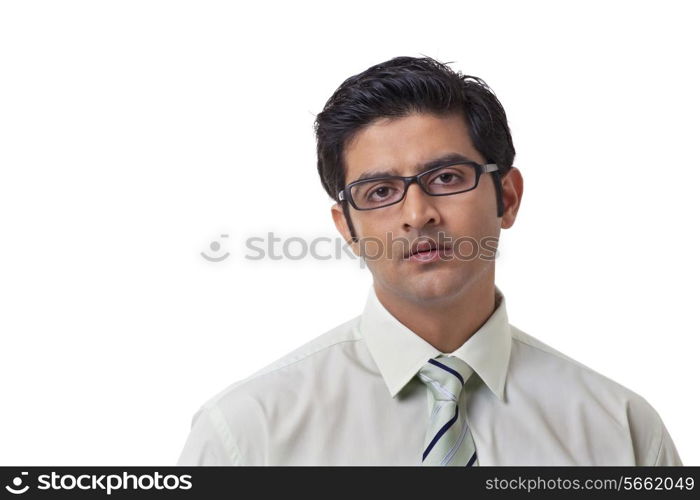 Confident businessman wearing glasses over white background