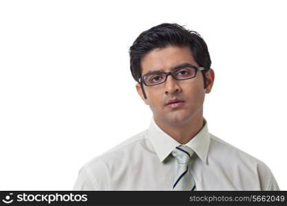 Confident businessman wearing glasses over white background
