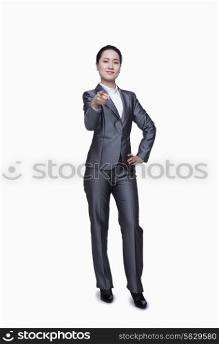 Confident businesswoman pointing at camera