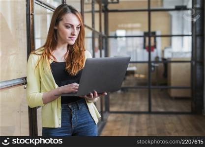 confident businesswoman using laptop workplace