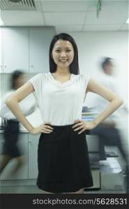 Confident Businesswoman with Rushing Colleagues Behind Her