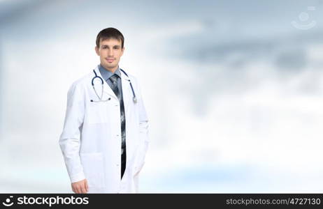 Confident doctor. Young handsome doctor with stethoscope against white background