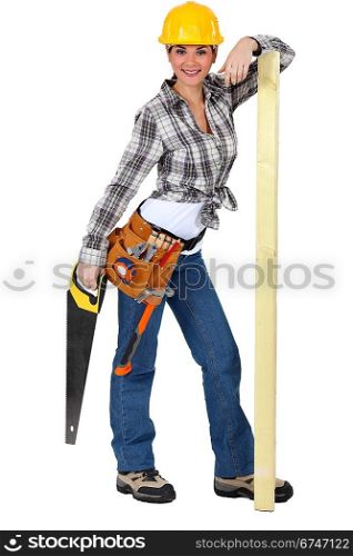 Confident female carpenter standing on white background