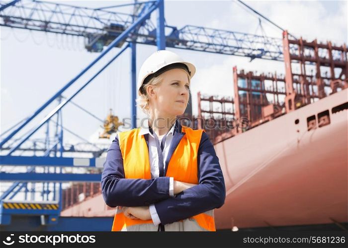 Confident female engineer in shipping yard