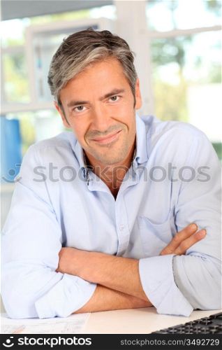 Confident handsome man with arms crossed