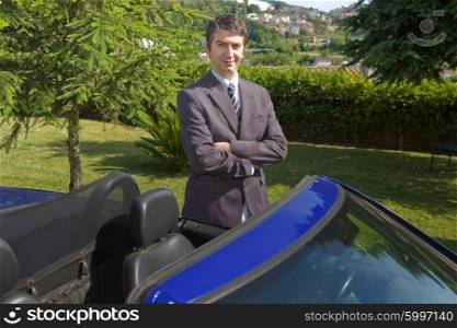 confident man car dealer standing outdoors