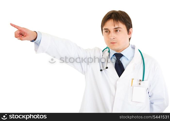Confident medical doctor pointing finger at something isolated on white&#xA;