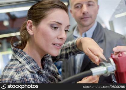 confident professional factory worker woman next to manager
