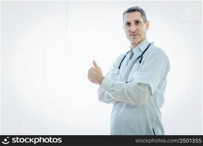 Confident smiling doctor posing with arms crossed at the hospital,Coronavirus has turned into a global emergency,Coronavirus Disease 2019 (COVID-19)