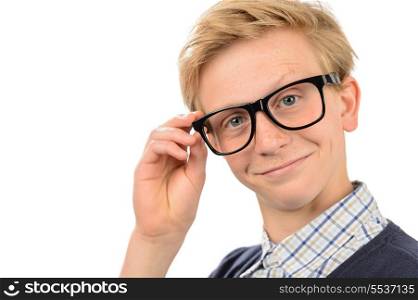 Confident teenage nerd boy holding geek glasses against white background
