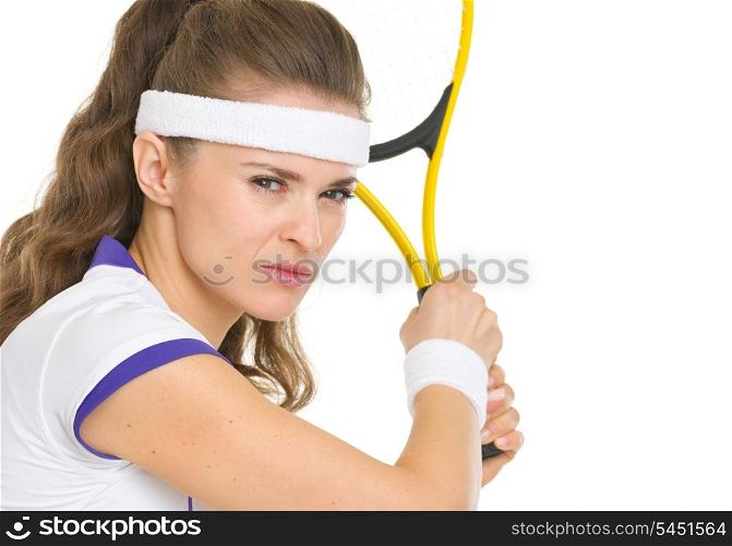 Confident tennis player ready to hit ball