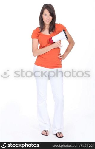 Confident woman holding megaphone