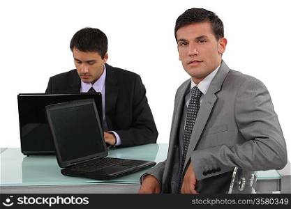Confident worker sitting at his desk