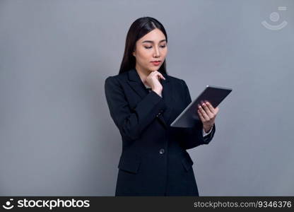 Confident young Asian busi≠sswoman posing with tab≤t on isolated background. Office lady make hand holding≥sture for promotions sa≤s, technology and innovation∏ucts advertisements. Jubilant. Office lady make hand holding≥sture for advertisements with laptop. Jubilant