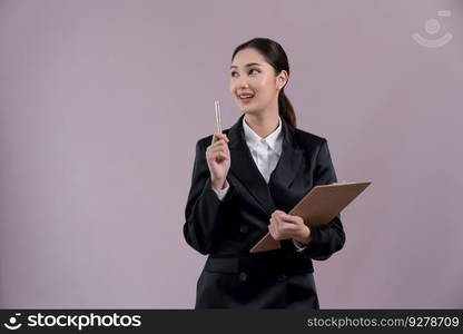 Confident young asian businesswoman in formal suit holding clipboard and pointing finger up to indicate promotion or advertising with amazed expression and gesture on isolated background. Enthusiastic. Confident young asian businesswoman in formal suit pointing finger. Enthusiastic