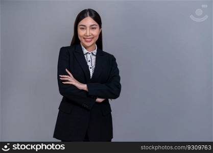 Confident young Asian businesswoman posing in professional outfit on isolated background. Symbol of success, optimism, and corporate office lady for business promotions and advertisements. Jubilant. Confident young Asian businesswoman posing on isolated background. Jubilant