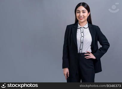 Confident young Asian businesswoman posing in professional outfit on isolated background. Symbol of success, optimism, and corporate office lady for business promotions and advertisements. Jubilant. Confident young Asian businesswoman posing on isolated background. Jubilant