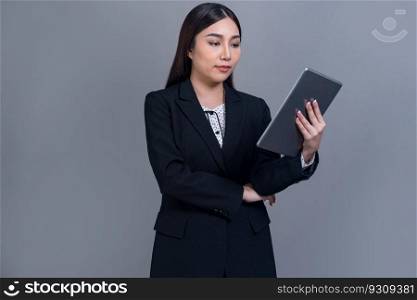 Confident young Asian businesswoman posing with tablet on isolated background. Office lady make hand holding gesture for promotions sales, technology and innovation products advertisements. Jubilant. Office lady make hand holding gesture for advertisements with laptop. Jubilant