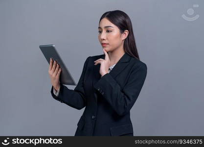 Confident young Asian businesswoman posing with tablet on isolated background. Office lady make hand holding gesture for promotions sales, technology and innovation products advertisements. Jubilant. Office lady make hand holding gesture for advertisements with laptop. Jubilant