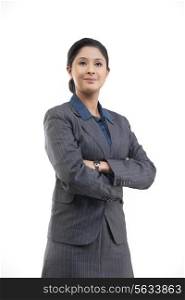 Confident young businesswoman in suit isolated over gray background