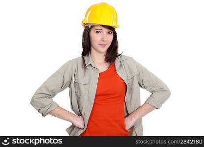 Confident young female builder