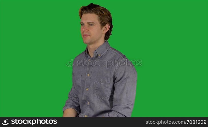 Confident young man in grey shirt (Green Key)