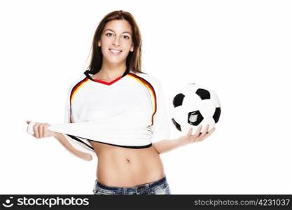 confident young woman holding football pulling her shirt. confident young woman holding football pulling her shirt on white background