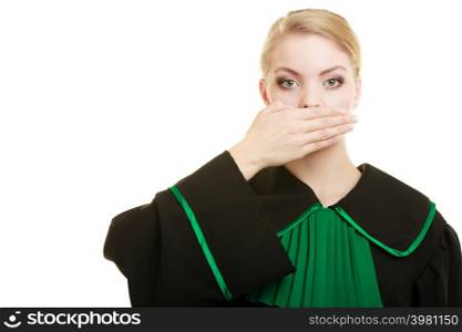 Confidential information. Law court or justice concept. Woman lawyer barrister wearing classic polish black green gown covering mouth with hand.