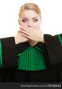 Confidential information. Law court or justice concept. Woman lawyer barrister wearing classic polish black green gown covering mouth with hands.