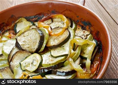 Confit byaldi - variation on the traditional French dish ratatouille .