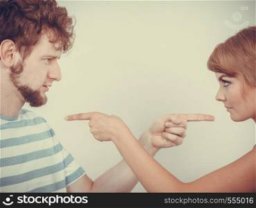 Conflict bad relationships concept. Two people couple pointing fingers at each other