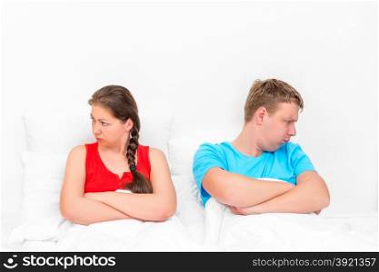 conflict situation of a young couple in bed