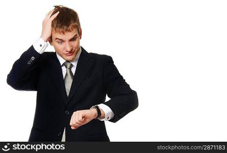Confused businessman looking at watch