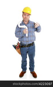 Confused construction worker using an electrical wire stripper on a plumbing pipe. Full body isolated on white.