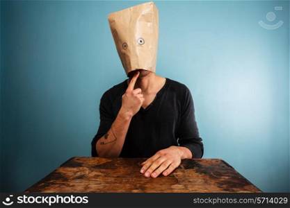 Confused man with a paper bag over his head