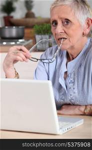 Confused old lady with laptop