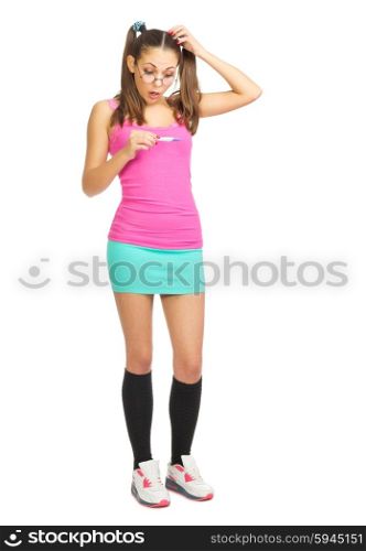 Confused schoolgirl with pregnancy test isolated