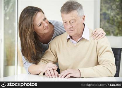 Confused Senior Man With Adult Daughter At Home