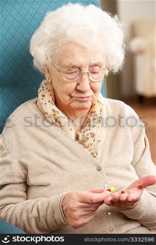 Confused Senior Woman Looking At Medication
