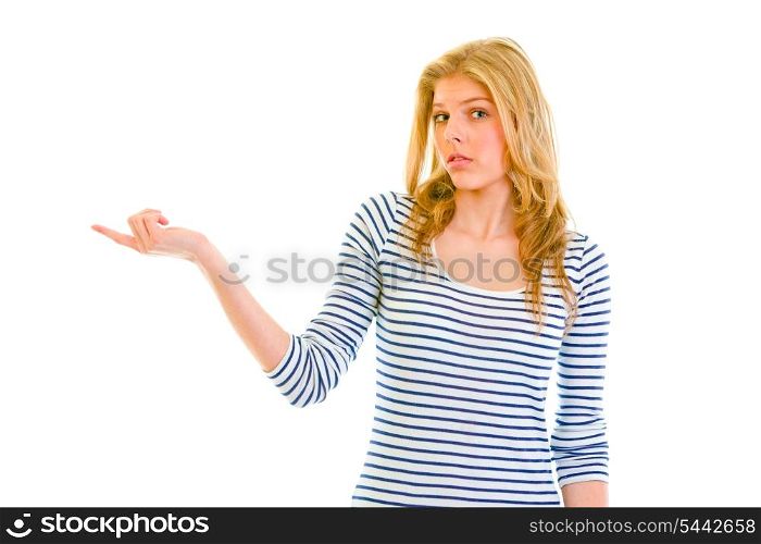 Confused teen girl pointing in corner&#xA;