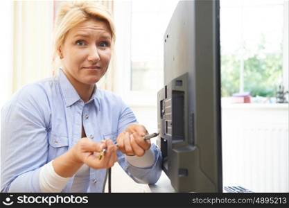 Confused Woman Unsure As to How To Put Leads Into New Television