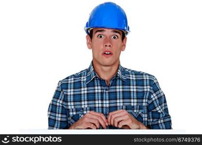 Confused young builder